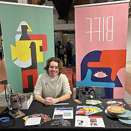 Nico Doret'24 at a booth for the Beloit International Film Festival